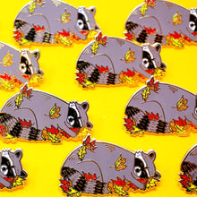Load image into Gallery viewer, Sleeping raccoon in fall leaves enamel pin